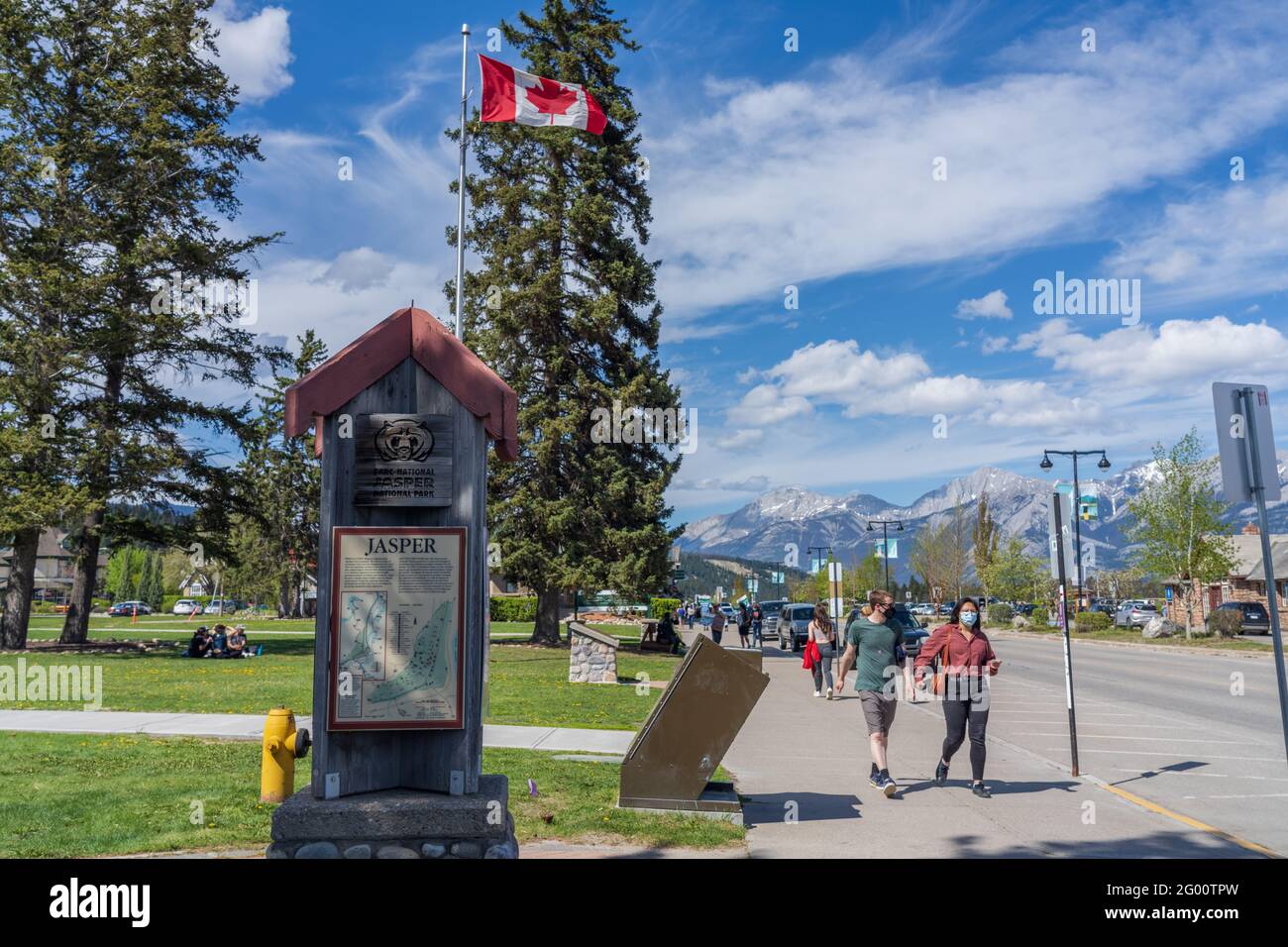 Street view of Town Jasper in summer time season during covid-20 pandemic period, people are wearing face masks. Jasper, Alberta, Canada. Stock Photo