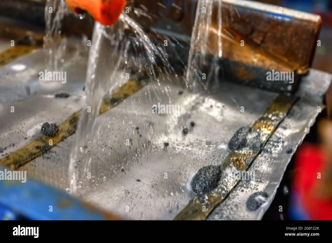 Vibrating screen, ore washing with liquid Stock Photo