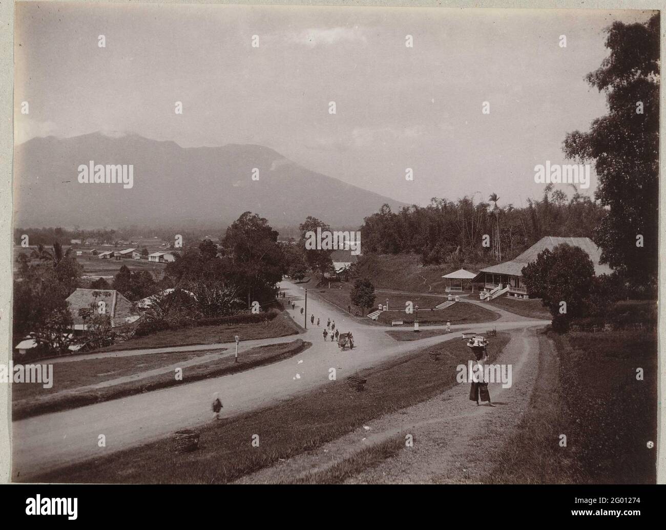 Overview of the town of BukittingGi on West Sumatra with the Merapi in the background.; Fort De Kock. A street face with an overview of the city of Bukittinggi on West Sumatra, in the merapi background. Stock Photo