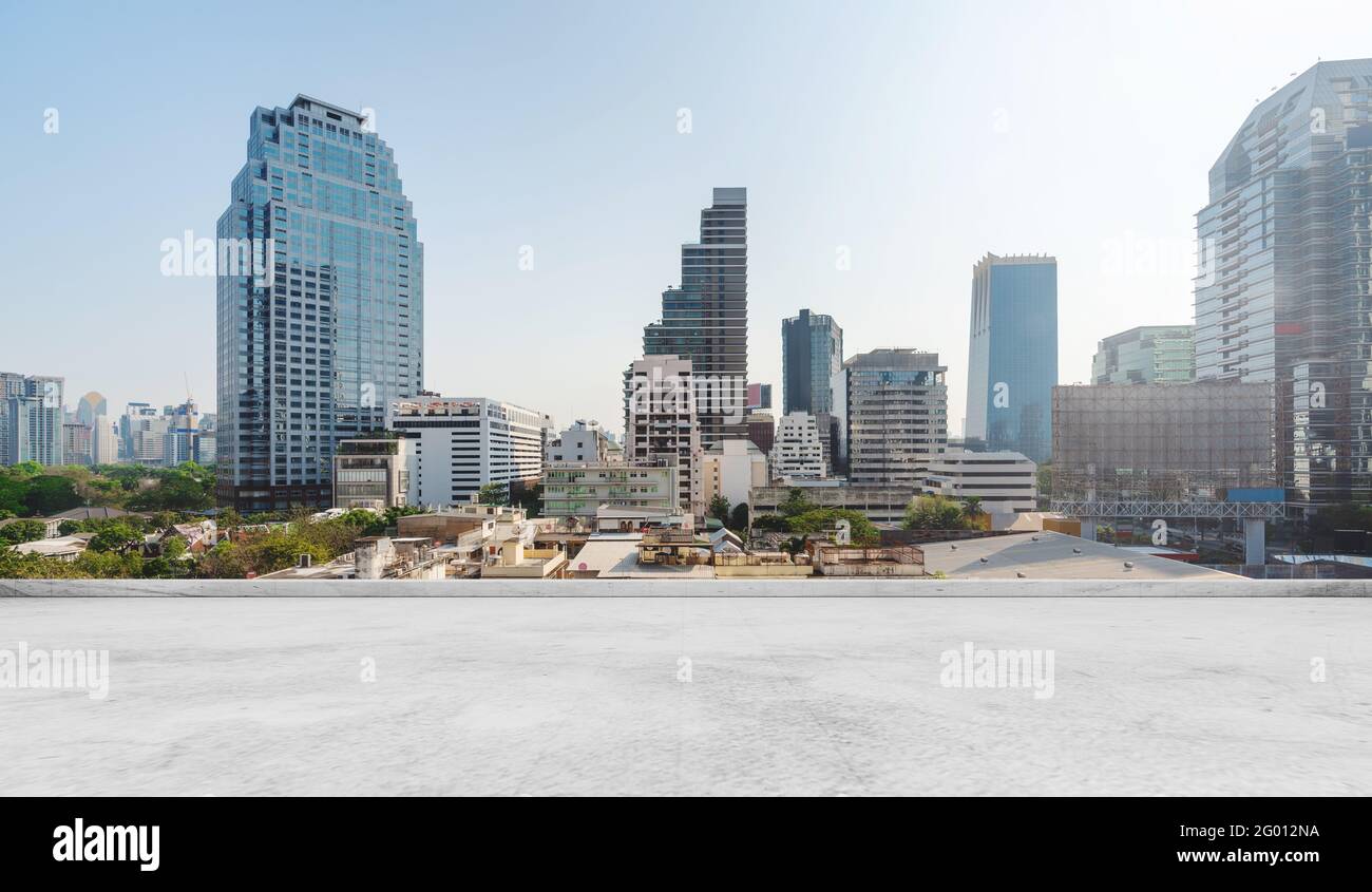 Bangkok city view, with concrete cement floor on roof top Stock Photo