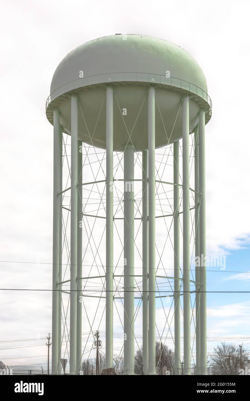HICKORY, NC, USA-1 FEB 2019: A green city water tower stands against a mostly overcast sky. Stock Photo