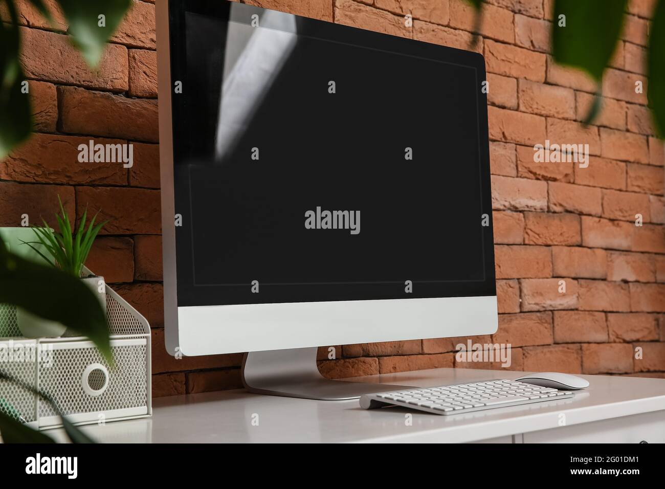 Window Computer With Brick Modern computer on table near brick wall Stock Photo - Alamy