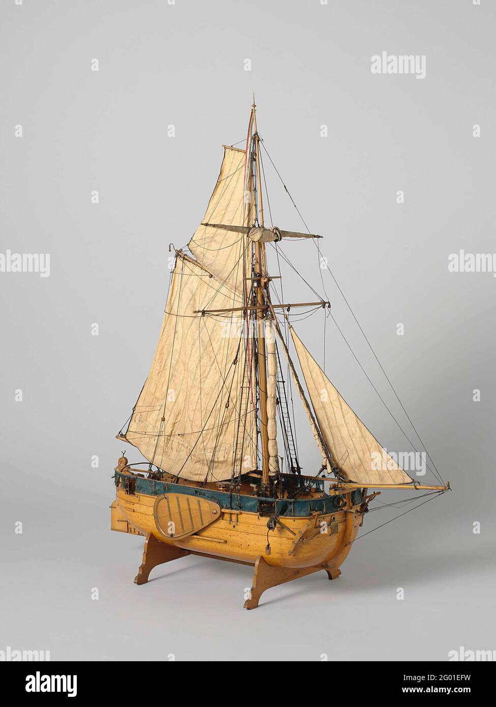 Model of a Gaff-rigged Gunboat. Witnessed out hollow block model of a one-mast platter gunboat, incomplete. Round bow and stern, a gate in the bow, two in the stern, four in the sides. The deck is detailed with a roasting pill, a chimney for the galley, shutters, a roef, a compass house, two pumps, ten cannons and two anchors. Around a slip rug, four forks on the conveying and four posts on either side for an increased slip rug. Bened deck not worked out. Wide stir with decorated stirring head and wooden helm over the deck. Flat seam, a barque, swords. The model has been tidable with a one-mas Stock Photo