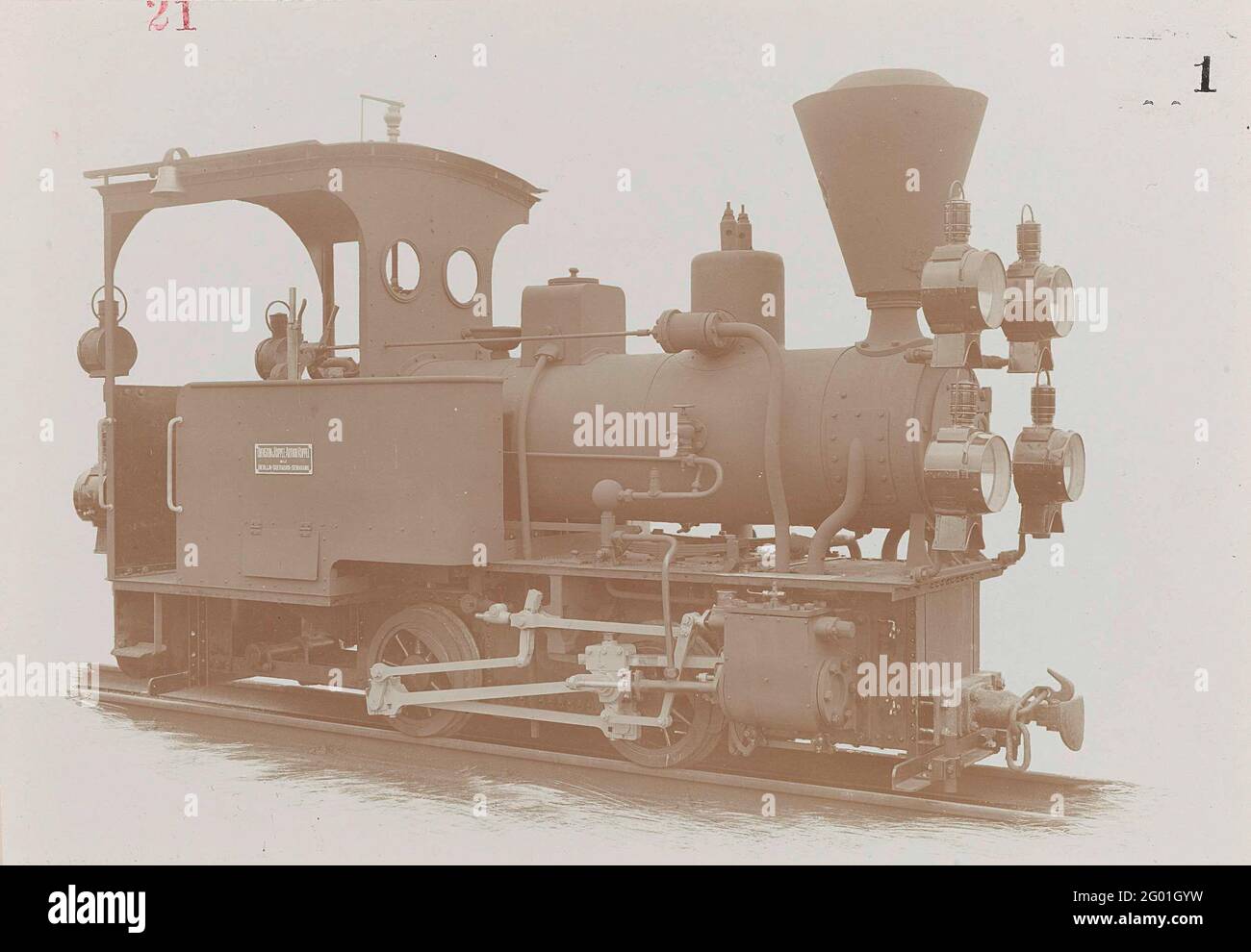 A sugar locomotive of the Dutch Indian railways. Locomotive by Orenstein & Koppen-Arthur couple, photographed in a workshop on a piece of rails. The locomotive has four headlights. Stock Photo