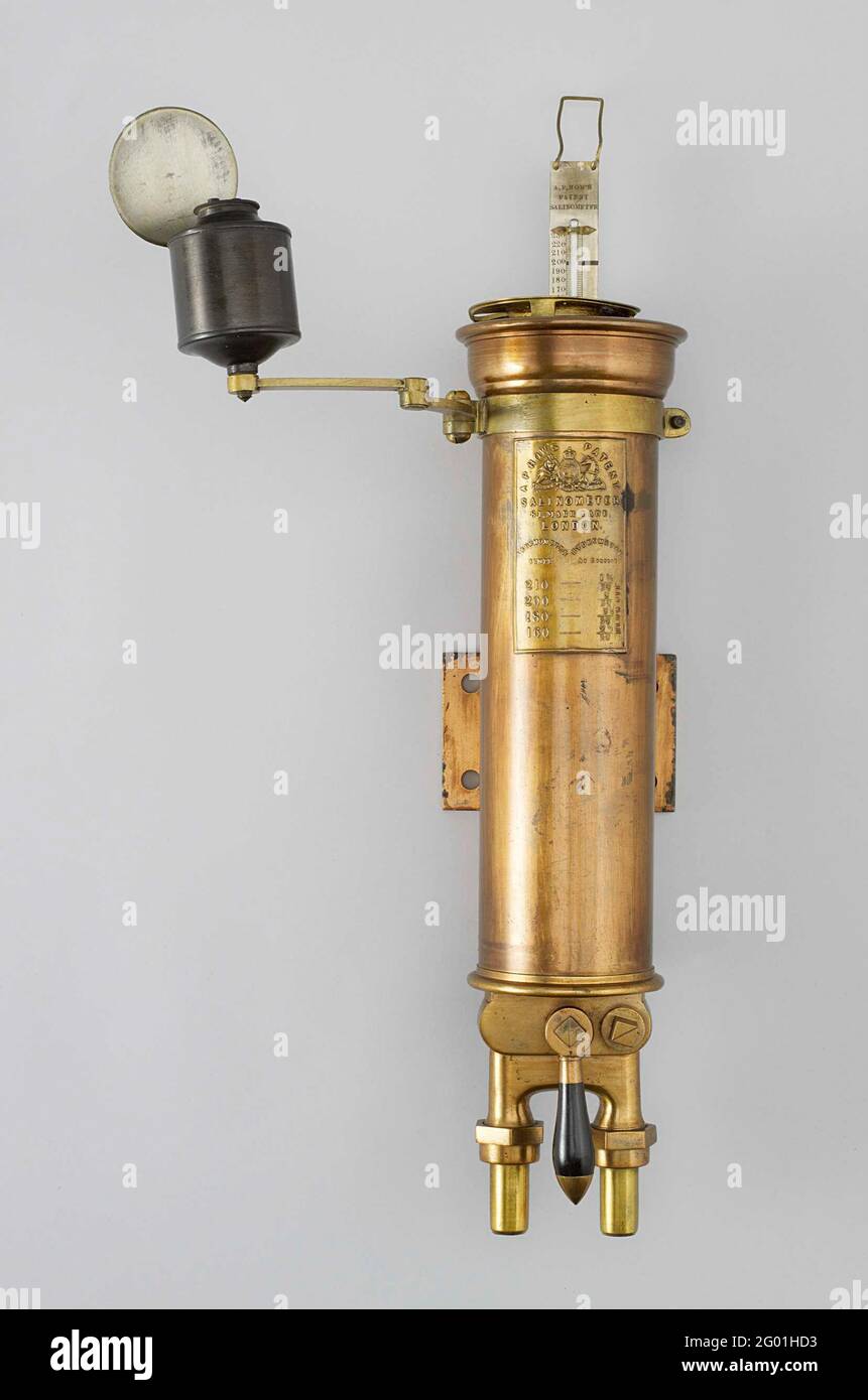 Salinometer. Salinometer, incomplete. It consists of a heavy copper tube or barrel with two pipes at the bottom. One pipe has a crane and serves as a supply for boiler water; The vessel is filled and the excess water runs the barrel via a landing to the second pipe. This makes it possible to measure a constant current boiler water to determine an average. After measuring, the water that remains in the vessel can be removed to the drain pipe by means of a second crane. In the vessel itself, a brass cylinder for the hydrometer (missing) and a thermometer are applied. Against the outside, a light Stock Photo
