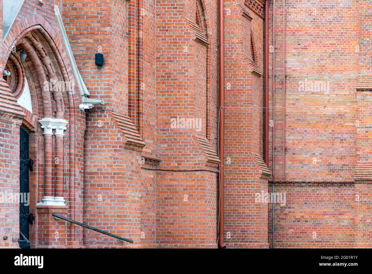 Fragment red brick wall catholic church nice background. Stock Photo