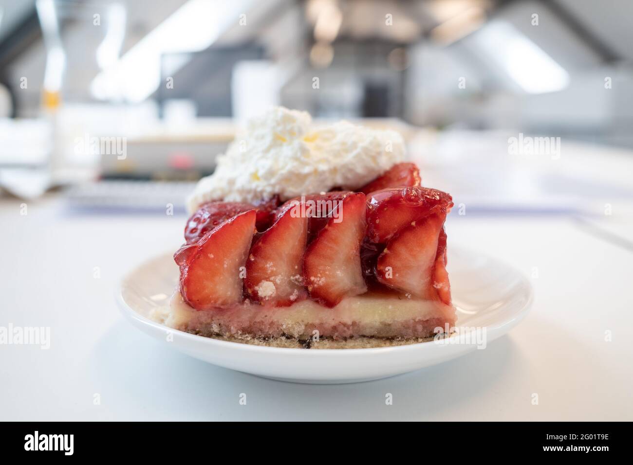 Traditional German sliced fresh strawberry cake tart or pie on topped