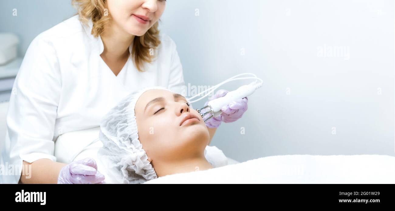 Woman at a beauticians appointment. Nonsurgical face lifting