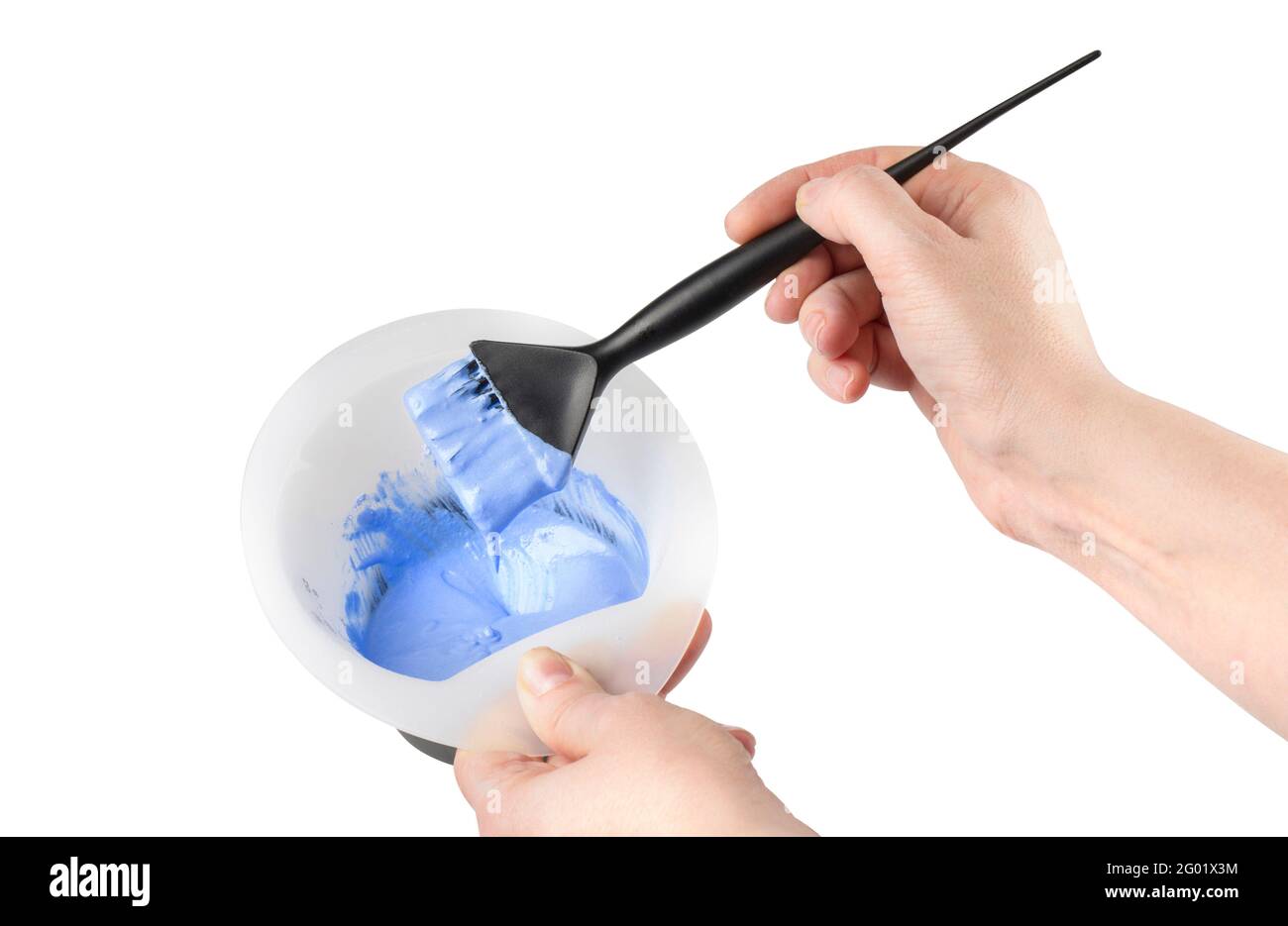 hair dye mixing bowl and brush with hand on white background with