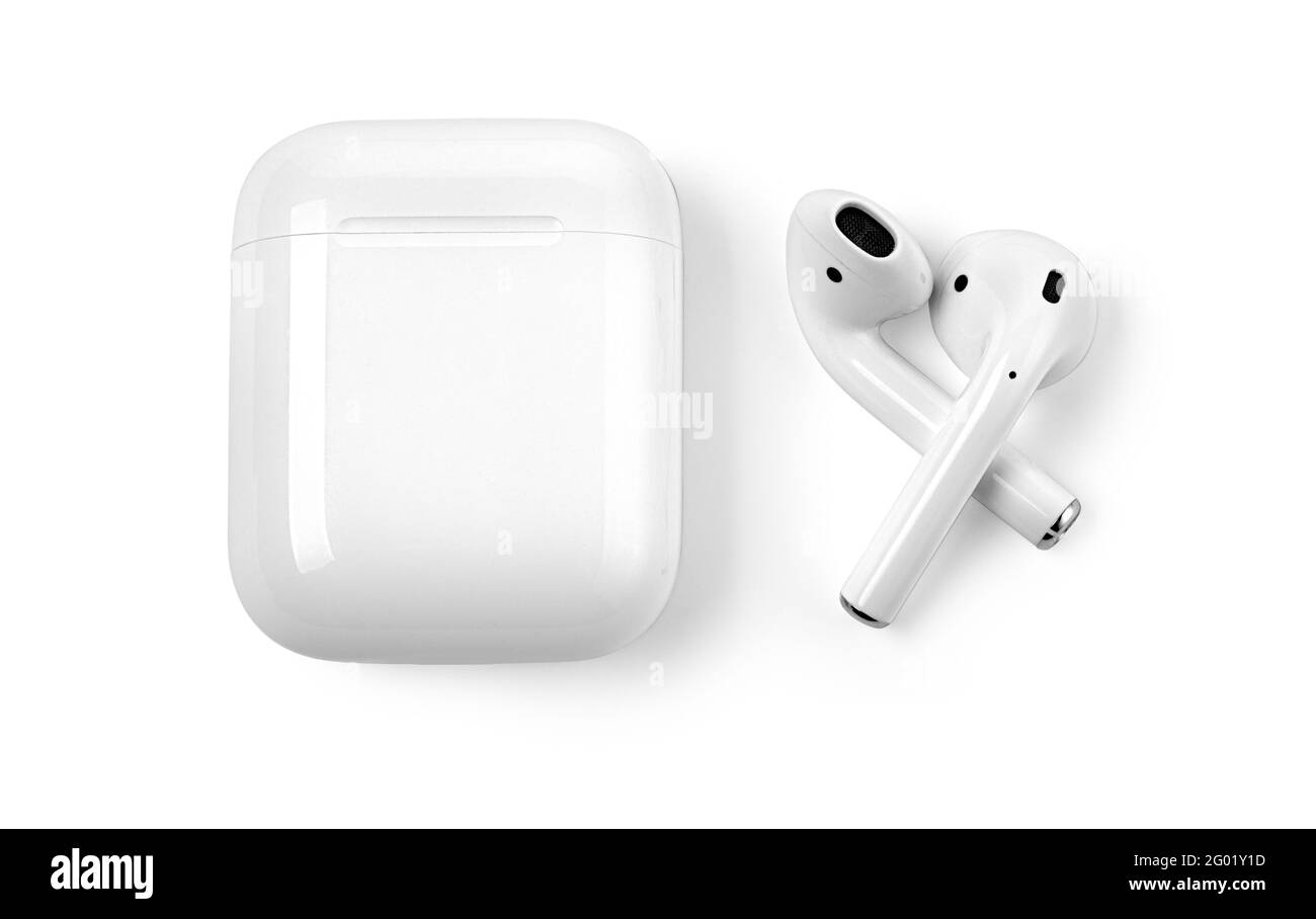 White headphones wireless earphones with case. White headphones wireless earphones isolated on white with clipping path. Stock Photo