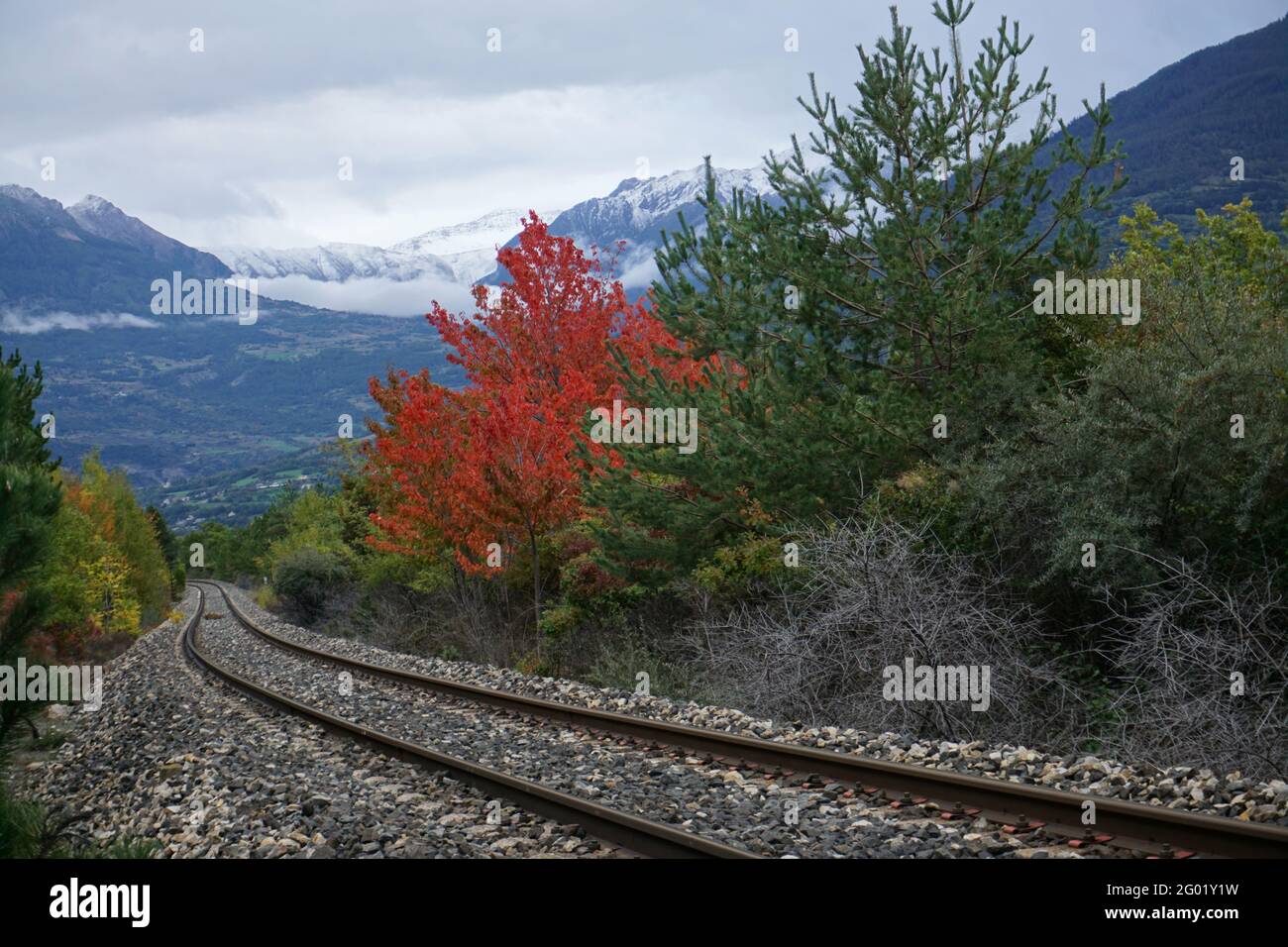 train tracks in serre ponçon france on a fall colorful day Stock Photo
