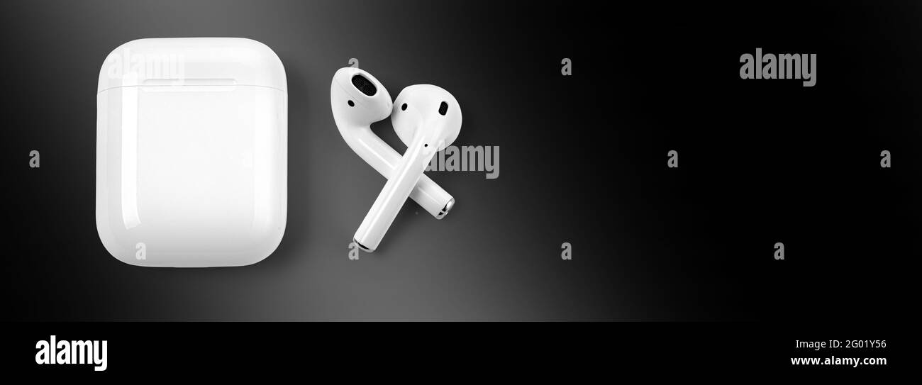 White headphones wireless earphones with case. White headphones wireless earphones on black background with copy space , with clipping path. Stock Photo