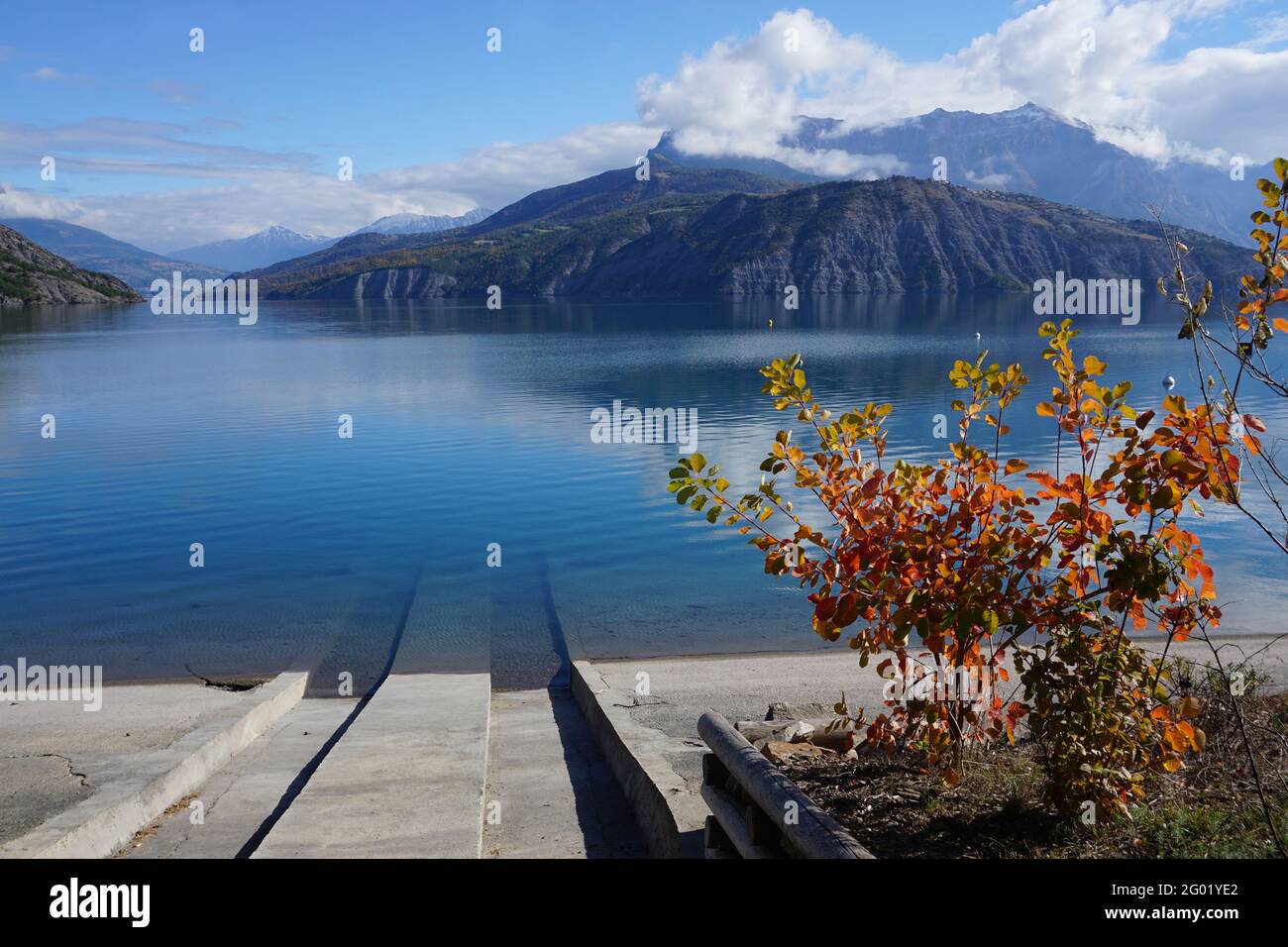 old stone boat launch in serre ponçon lake, france on na fall colorful day Stock Photo