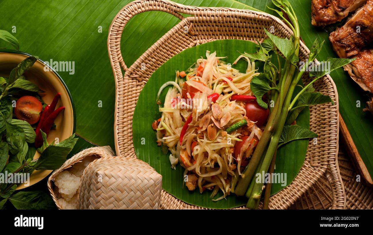 Papaya Rice Papaya salad (Somtum) serving with Thai style grilled chicken and ...