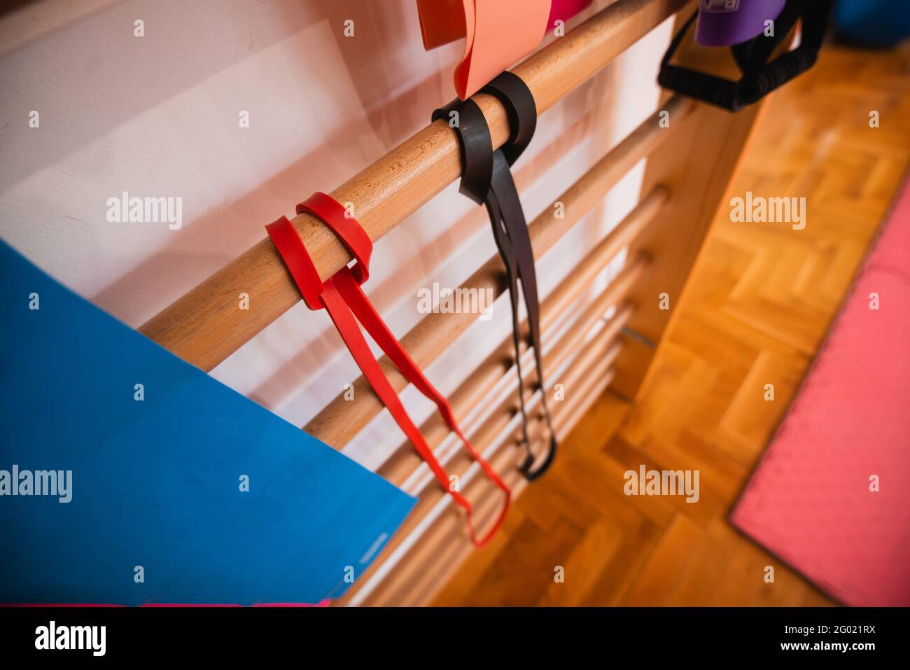 wooden bar ladder and sport equipment in school gym indoor Stock Photo