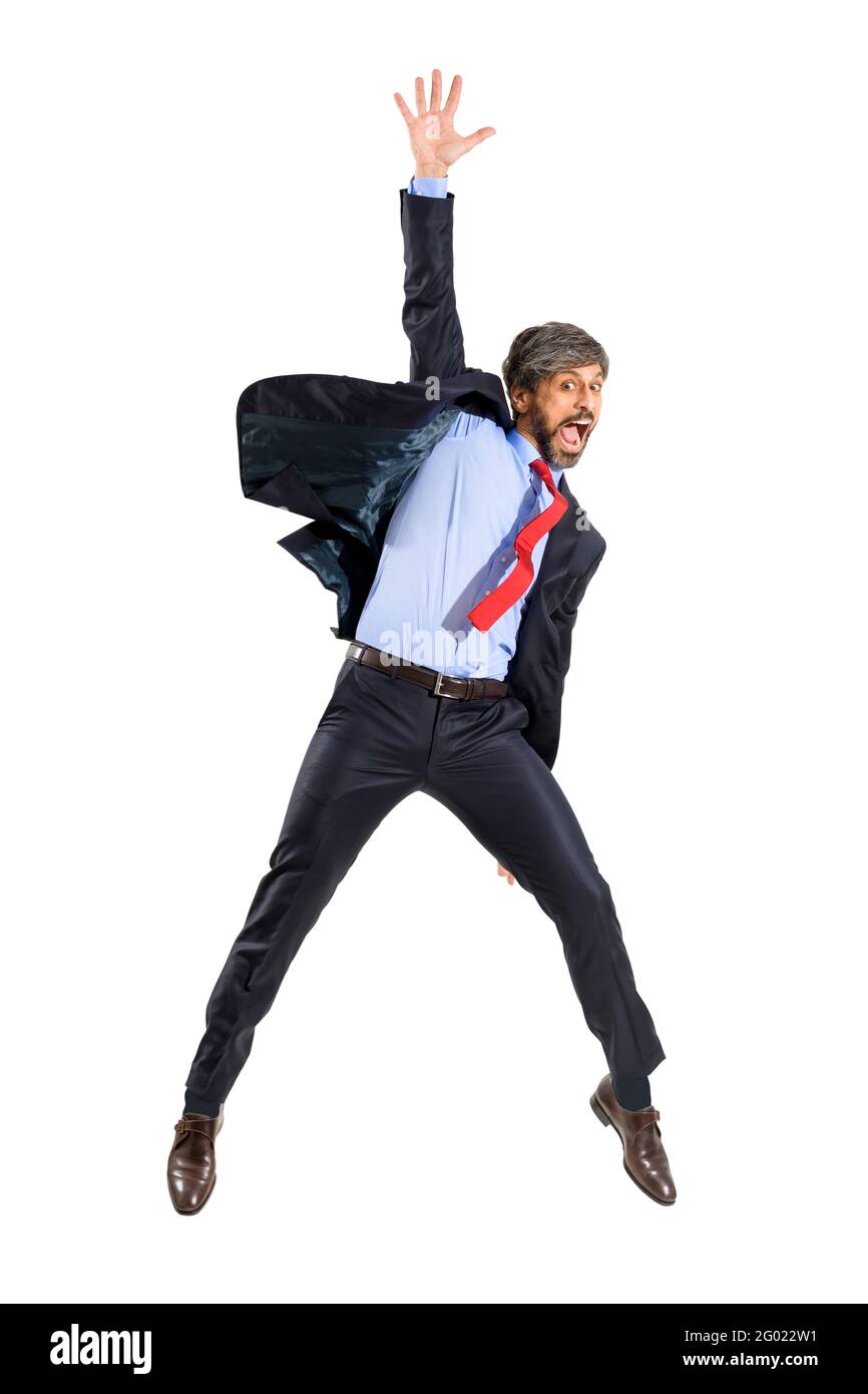 Triumphant excited businessman in stylish suit leaping in the air yelling in celebration of a personal success in a full length portrait isolated over Stock Photo