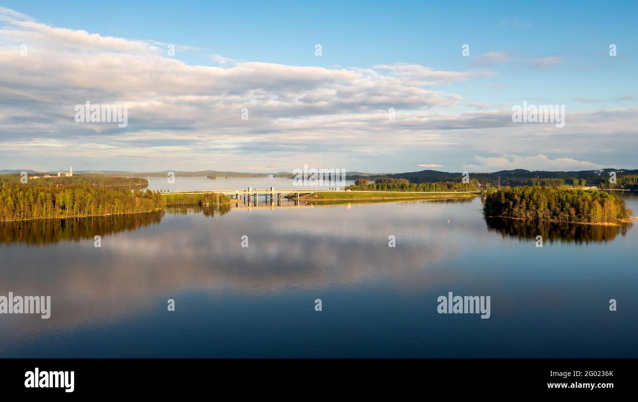 Three bridges and embankment for a motorway and railway in a lake landscape in Kuopio, Eastern Finland. Photographed in the summer in calm weather. Stock Photo