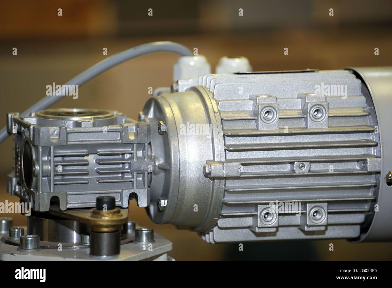 Powerful electric motor with reducer. Electric motor on machine Stock