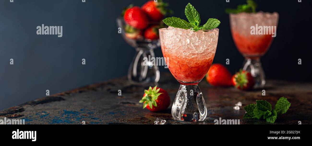 Fresh cocktail with crushed ice, strawberry and mint Stock Photo