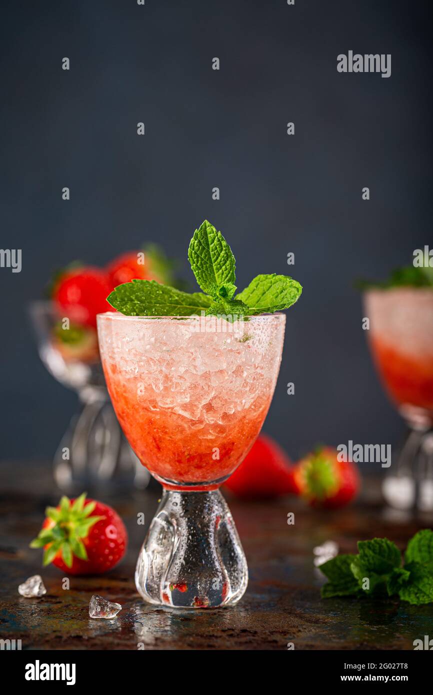 Fresh cocktail with crushed ice, strawberry and mint Stock Photo