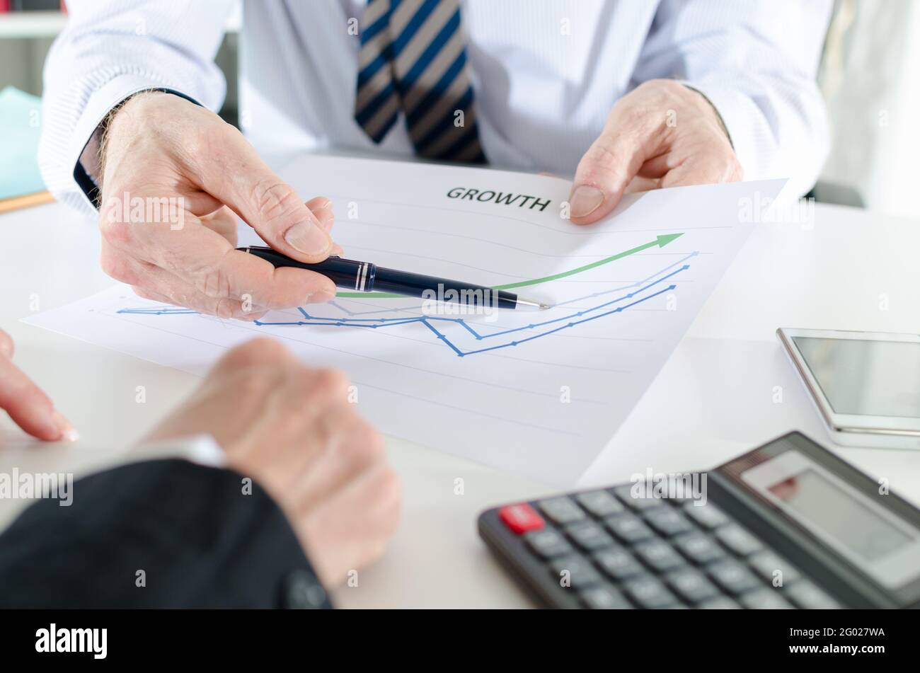 Analyzing growing results on a graphic Stock Photo - Alamy