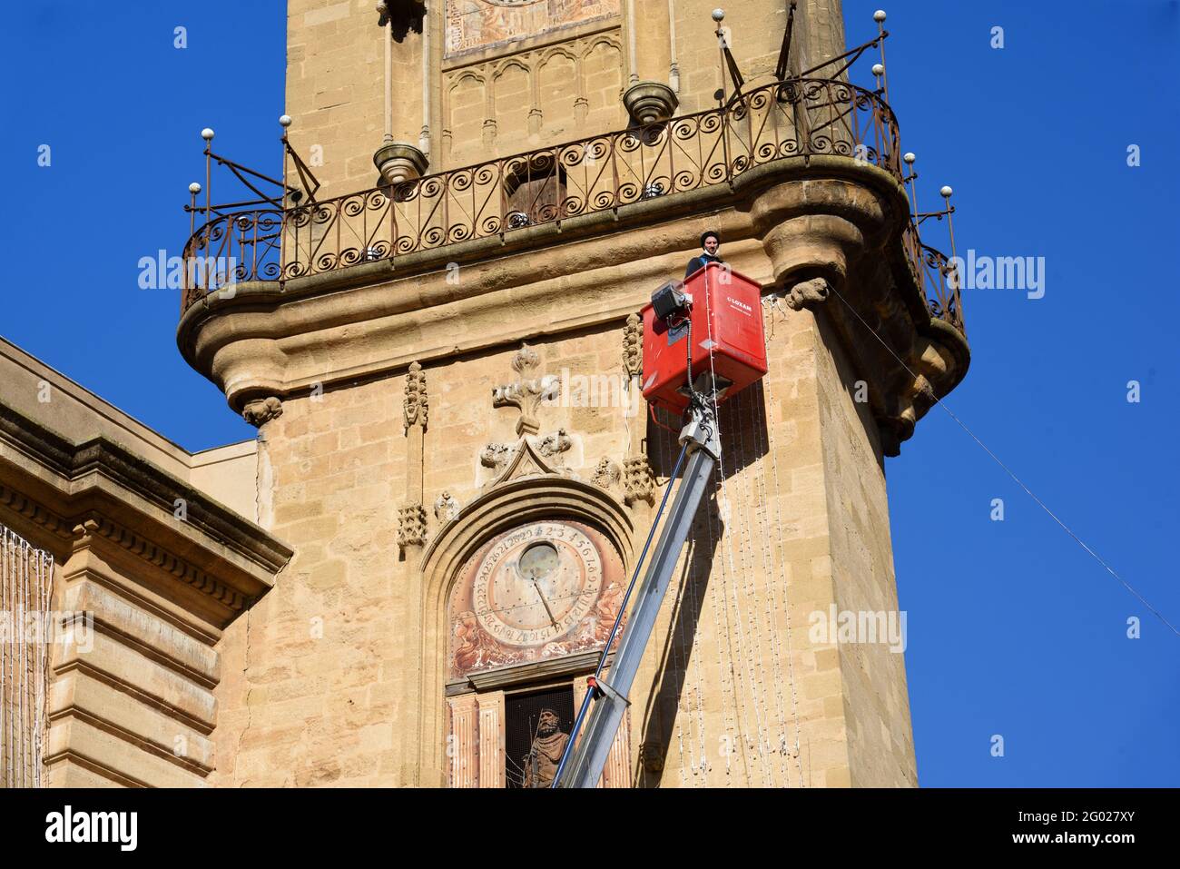 Worker Using Aerial Work Platform (AWP) or Elevating Work Platform (EWP) to Work on Historic Clock Tower in Aix-en-Provence France Stock Photo