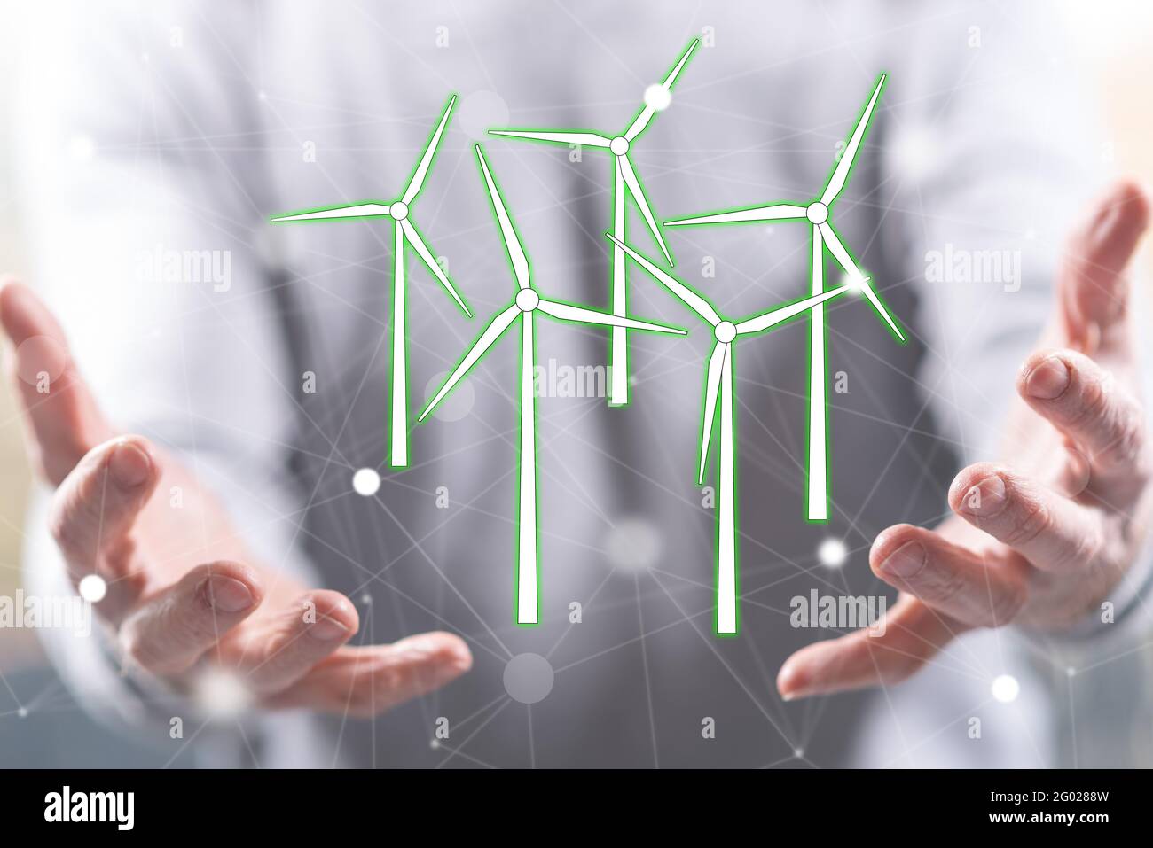 Clean energy concept above the hands of a man in background Stock Photo ...