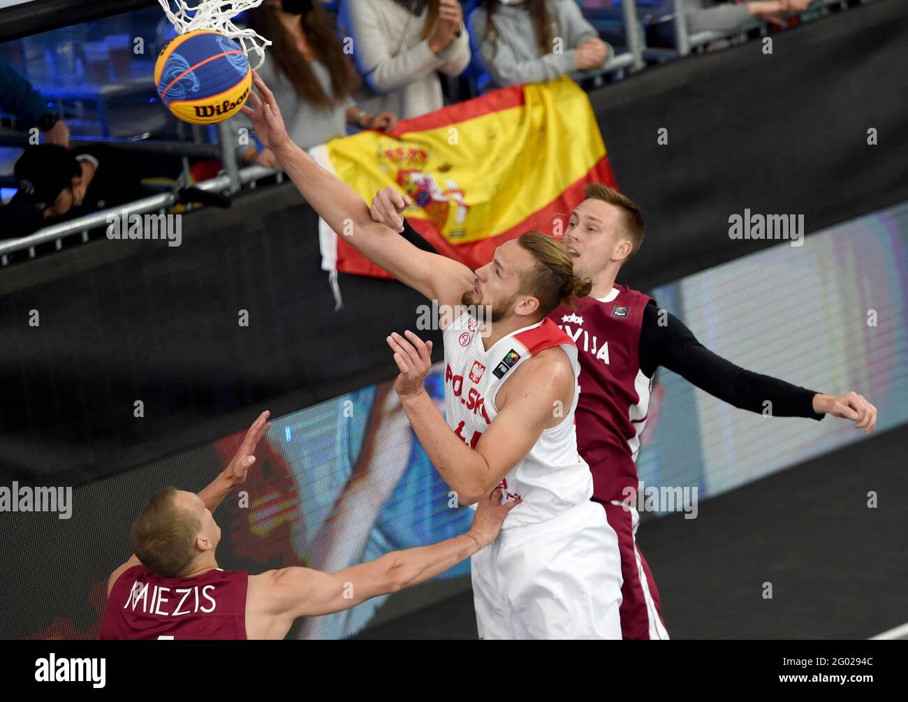 Graz, Austria. 30th May, 2021. Szymon Rduch (C) of Poland goes for the basket during a match between Poland and Latvia at the men's FIBA 3x3 Olympic Qualifying Tournament at Graz, Austria, on May 30, 2021. Credit: Wang Zhou/Xinhua/Alamy Live News Stock Photo