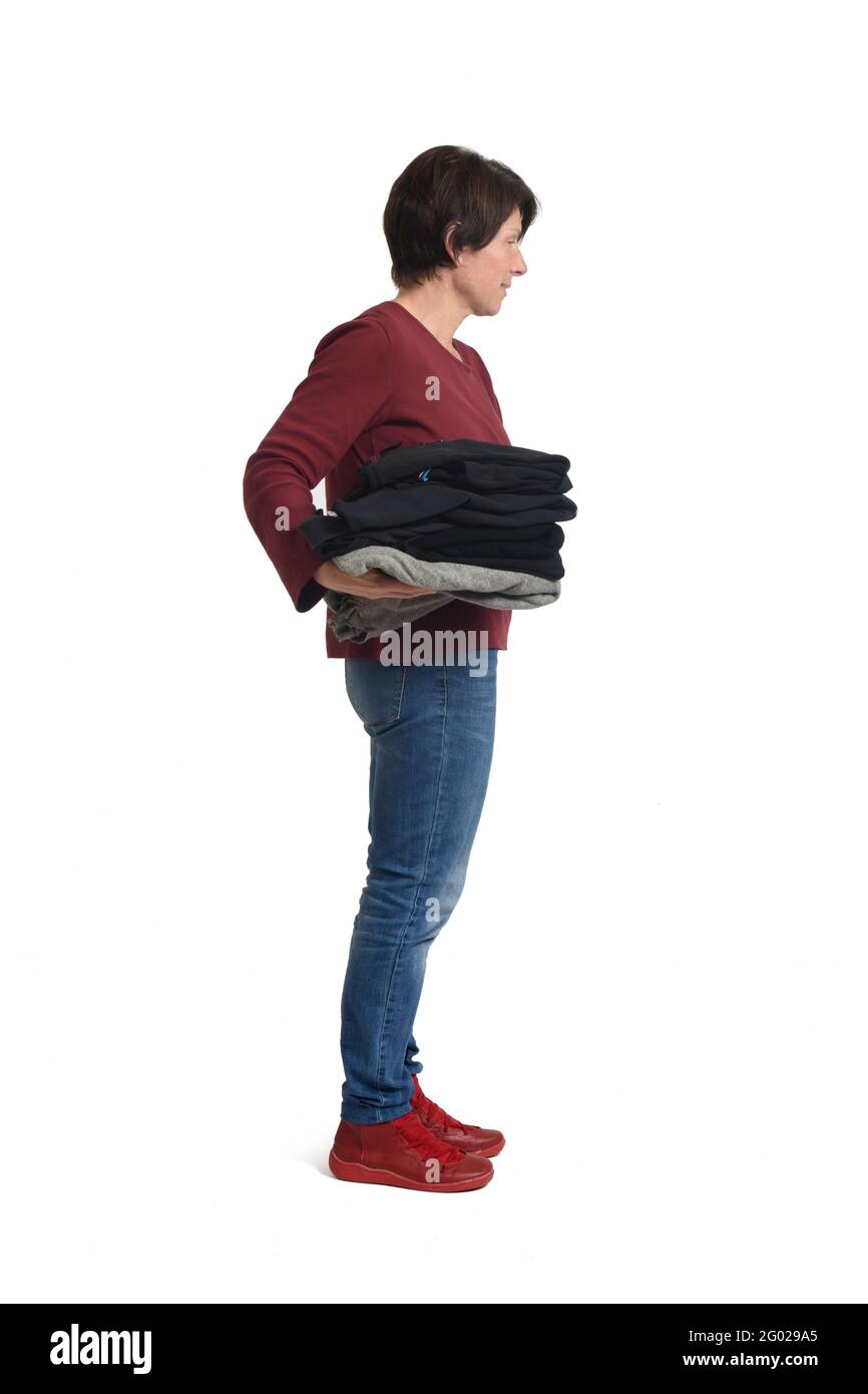 Holding fold clothes hi-res stock photography and images - Alamy