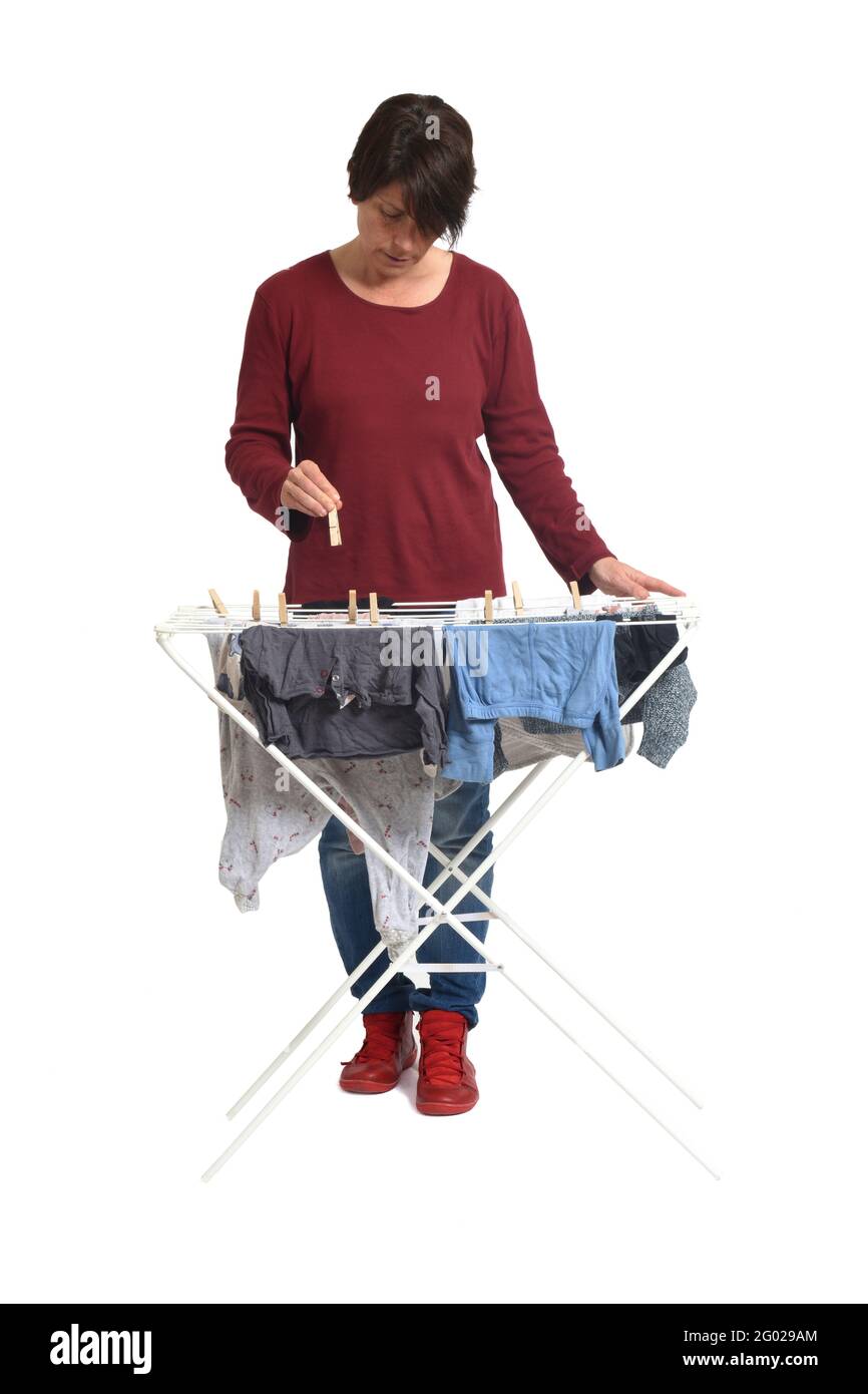 https://c8.alamy.com/comp/2G029AM/front-view-of-a-woman-hanging-clothes-on-white-background-2G029AM.jpg
