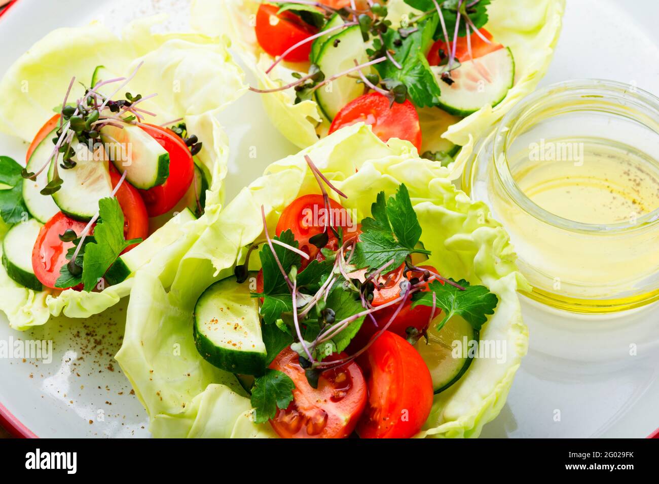 Vitamin summer salad with cabbage,cucumber,tomato and micro greens Stock Photo
