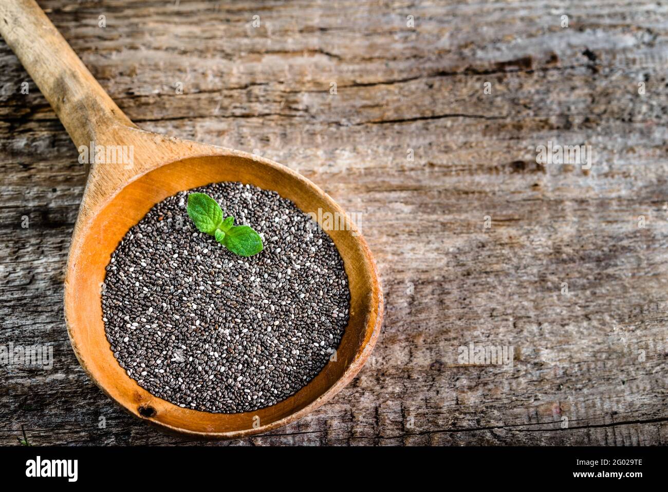 Healthy food, sources omega3 chia seed on wooden spoon, copy space