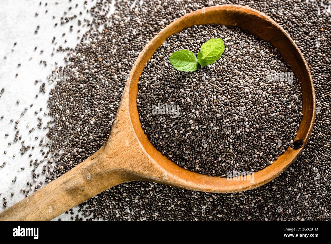 Healthy food, sources omega3 chia seed, top view closeup on wooden