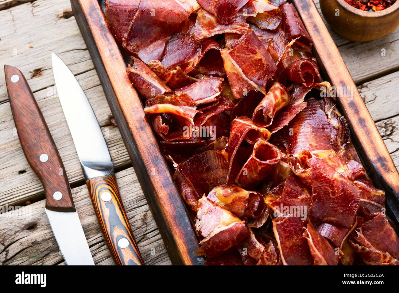 Sliced basturma or beef jerky.Horse meat jerky on cutting board