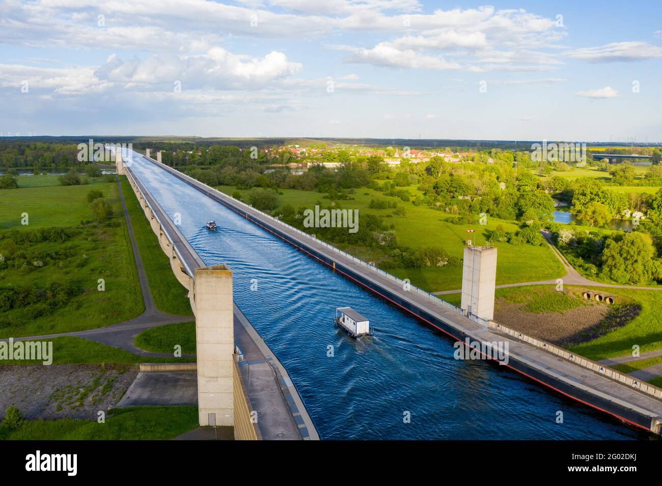 Magdeburg, Germany. 21st May, 2021. A motorboat and a houseboat cross