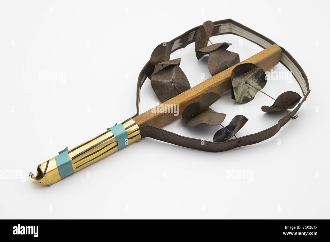 Ancient rattle or tambourine percussion musical instrument isolated on