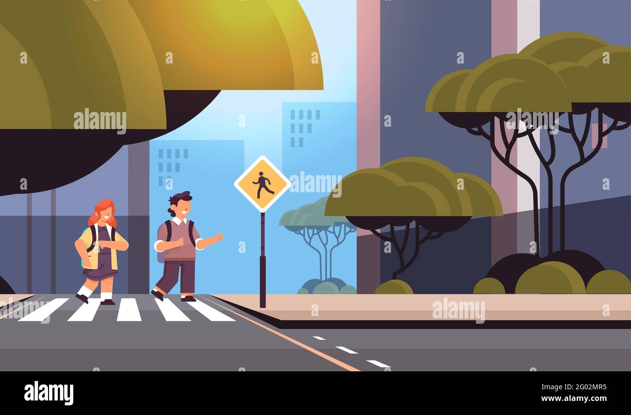 schoolchildren crossing road on crosswalk with signboard road safety ...