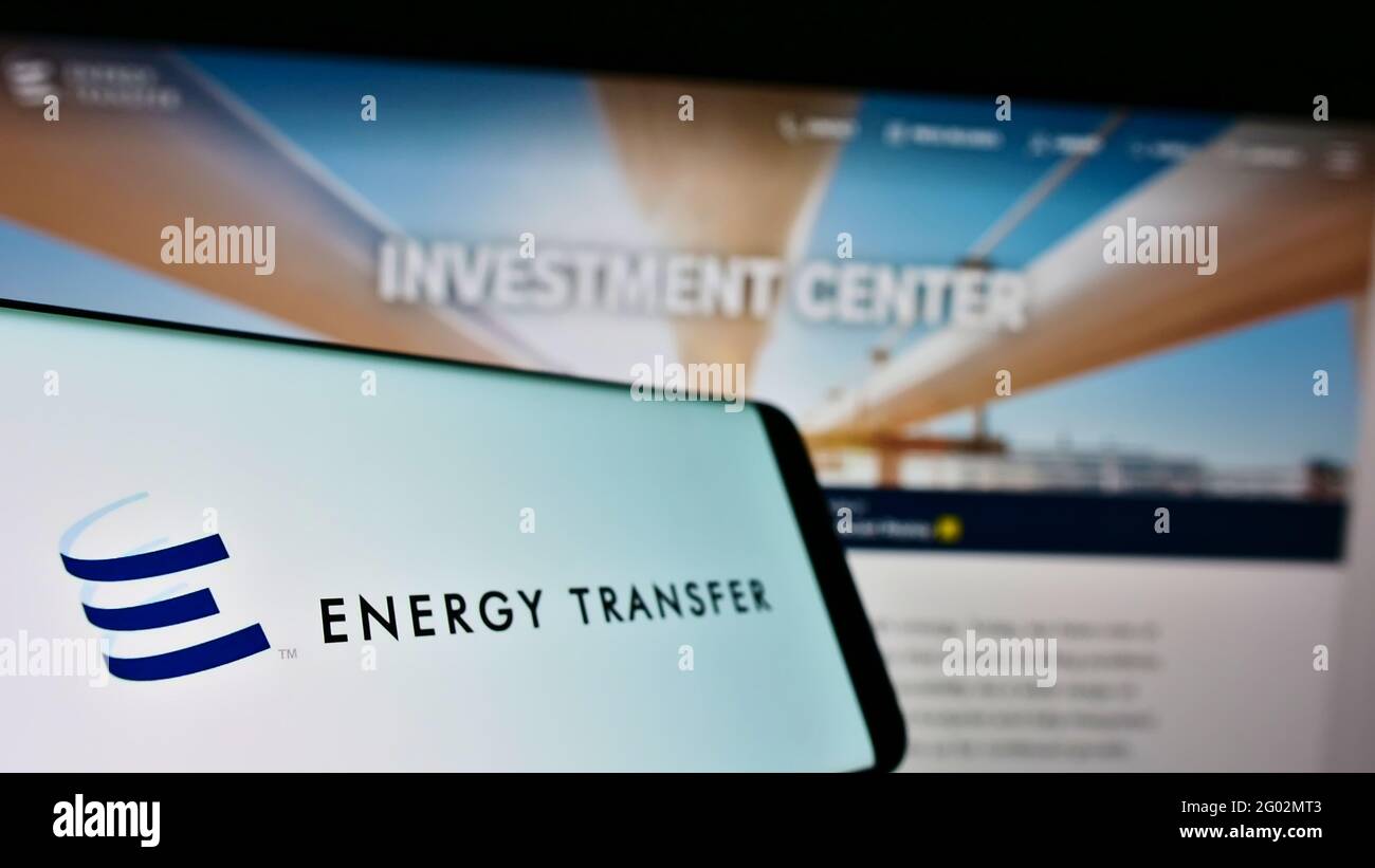 Smartphone with logo of US pipeline company Energy Transfer LP on screen in front of business website. Focus on center-left of phone display. Stock Photo