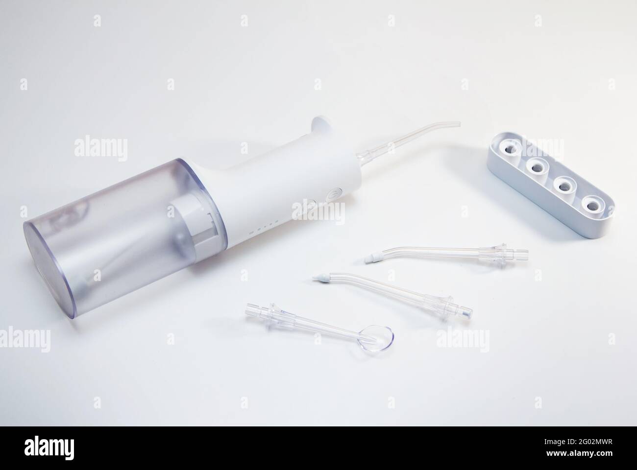 Electric dental irrigator with different nozzles – tools for teeth hygiene. Stock Photo