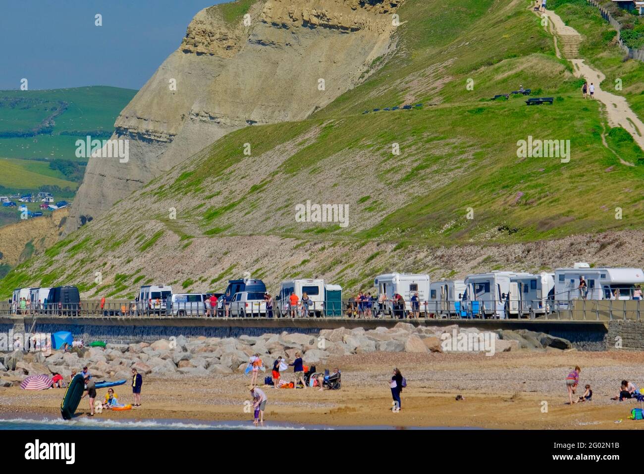 West Bay, Dorset, UK. , . Bank Holiday crowds gather at West Bay in Dorset on what promises to be the hottest day of the year so far . Credit: Tom Corban/Alamy Live News Stock Photo