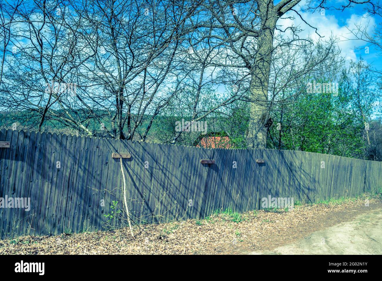 Old wooden fence at road, rural scene Stock Photo - Alamy