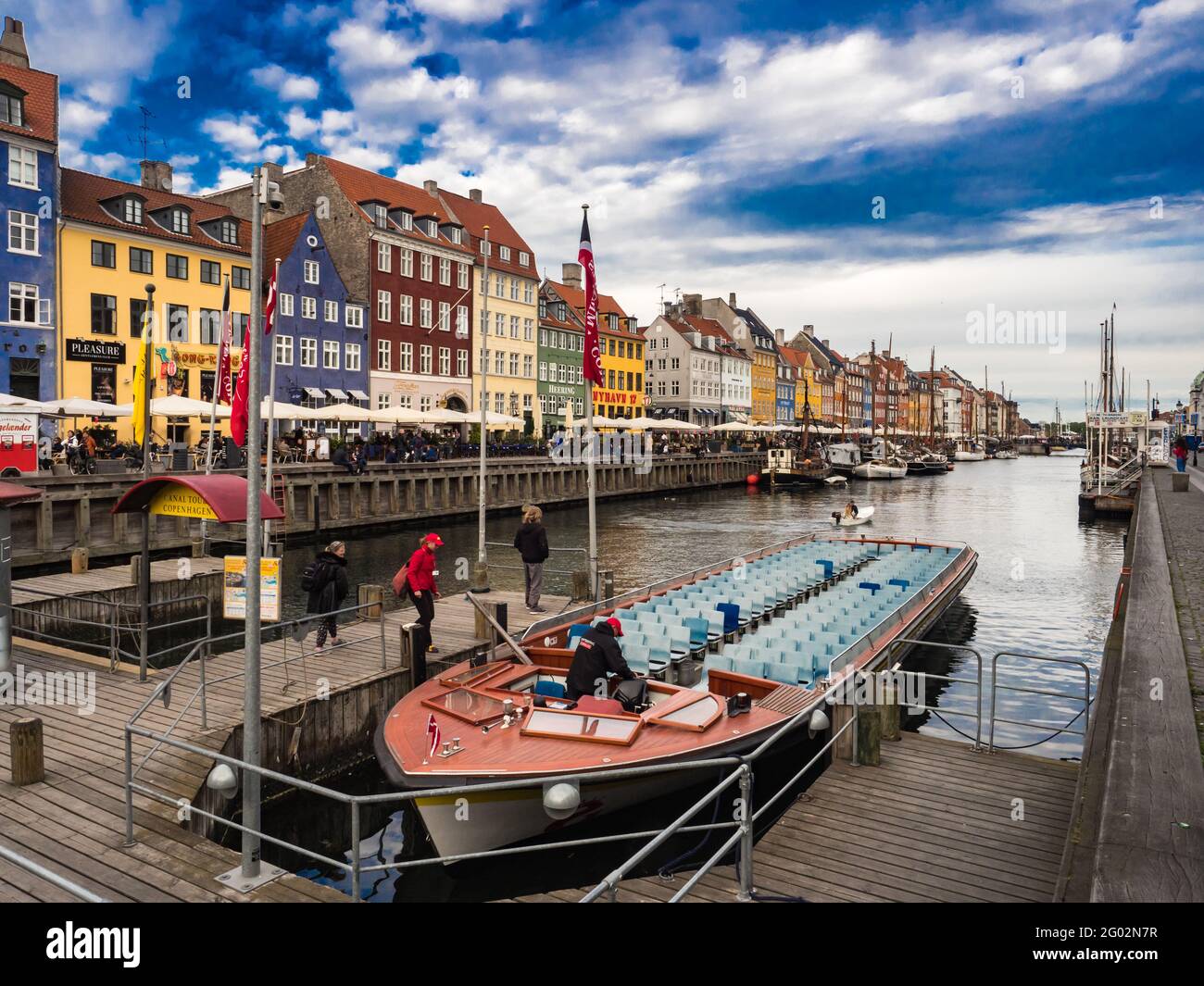 Nyhavn (New Harbour), Copenhagen, Denmark - May 2019: View of Nyhavn canal with color buildings, ships, yachts and other boats in the Old Town of Cope Stock Photo