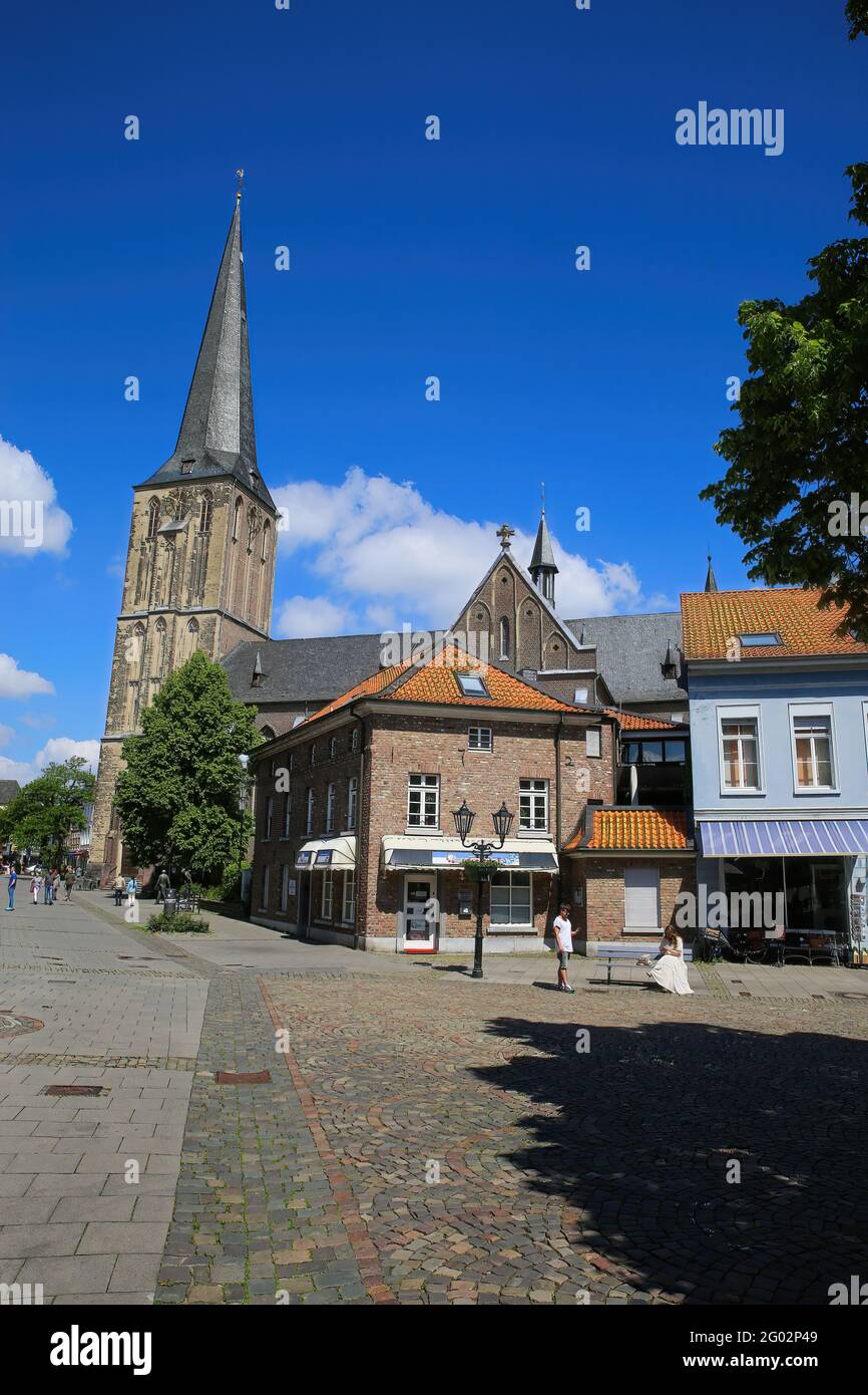 Viersen (Suchteln), Germany - May 20. 2021: View over square on medieval houses and shops with church tower background Stock Photo