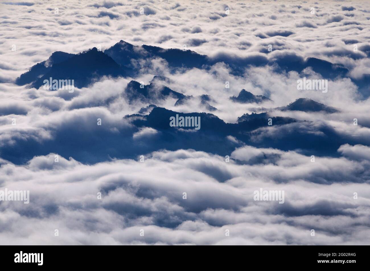 Sunrise over a sea of clouds seen from the Figuerassa viewpoint (Berguedà, Barcelona, Catalonia, Spain, Pyrenees) Stock Photo