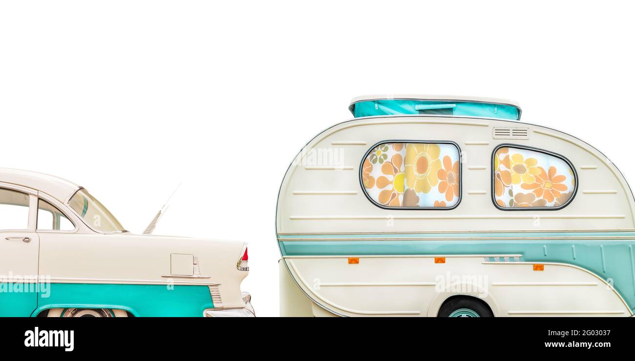 Retro classic car and seventies caravan with flower curtains in two-tone white with green isolated on a white background Stock Photo