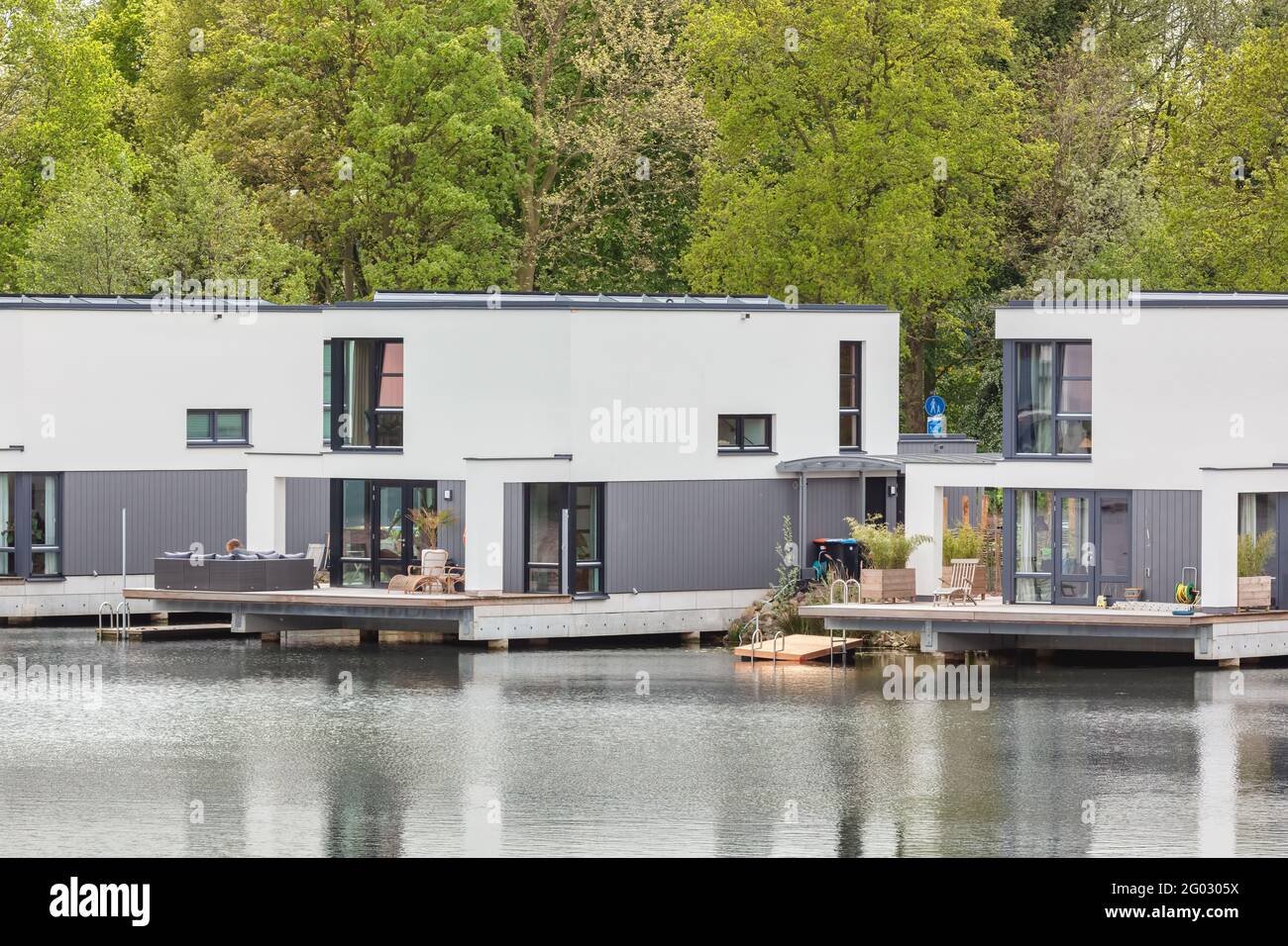 Deventer, The Netherlands - May 12, 2021: Row of contemporary floating house boats in Deventer, The Netherlands Stock Photo