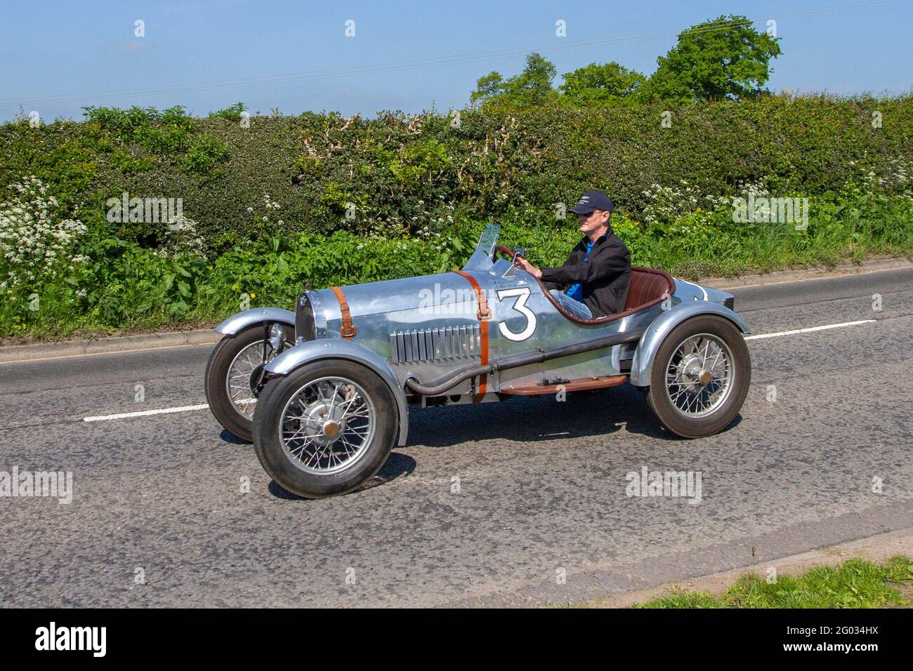 1934 30s thirties No.3 pre-war motorsport Silver Austin 7 special 748cc open-topped single seater tourer en-route to Capesthorne Hall class car event, Cheshire UK Stock Photo