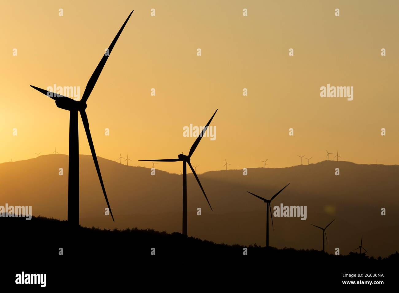 silhouettes of wind turbines at sunset Stock Photo - Alamy