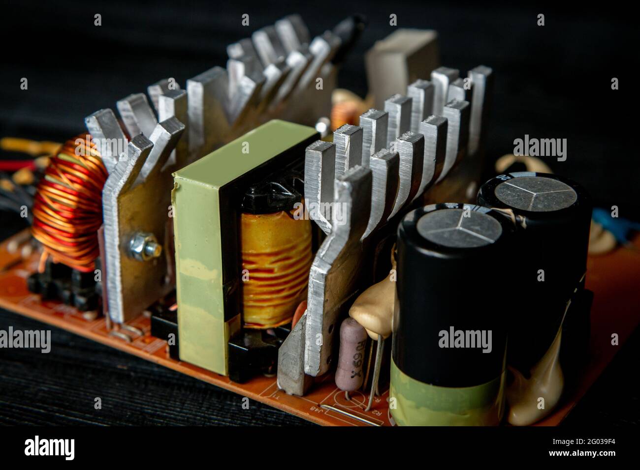 Part of pc power supply with radiator and electronic board with integrated stabilizers and