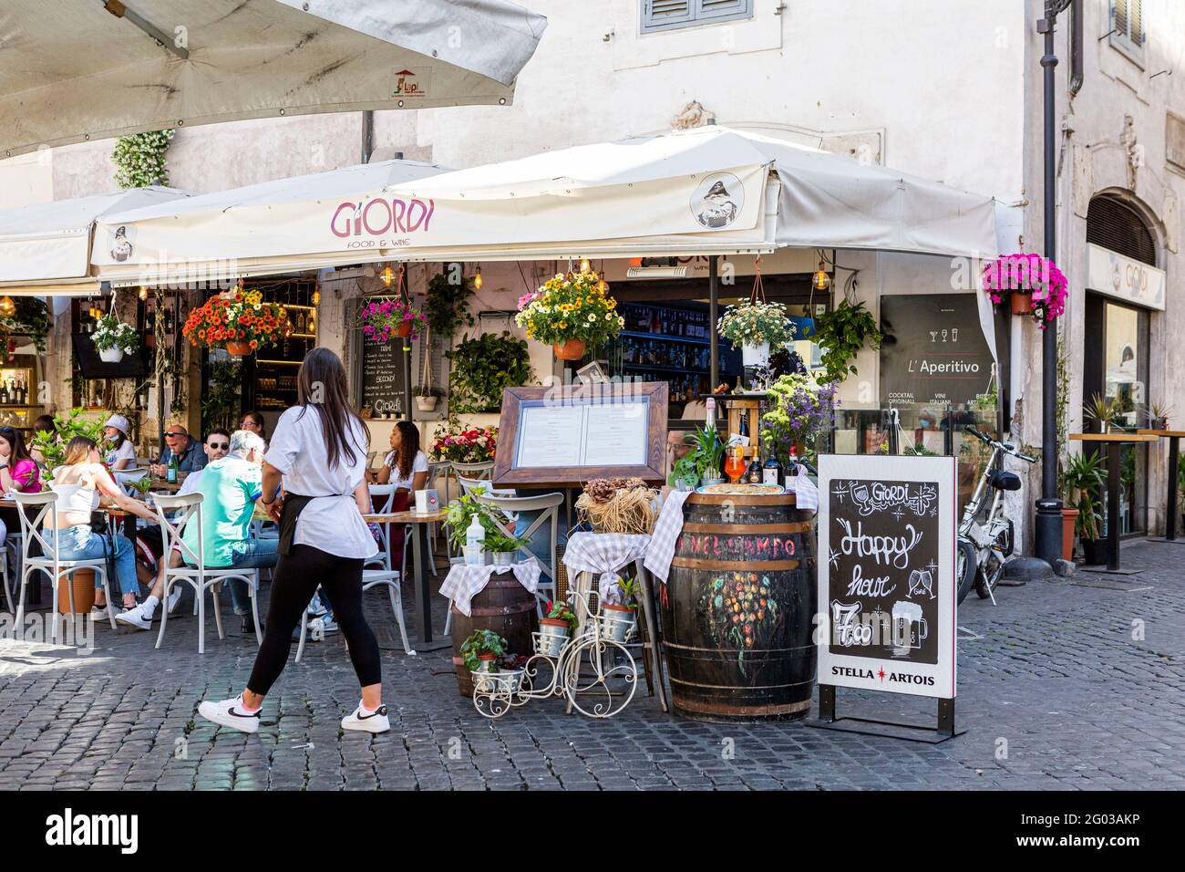People sitting at pavement cafés in Campo de Fiori in Rome Stock Photo